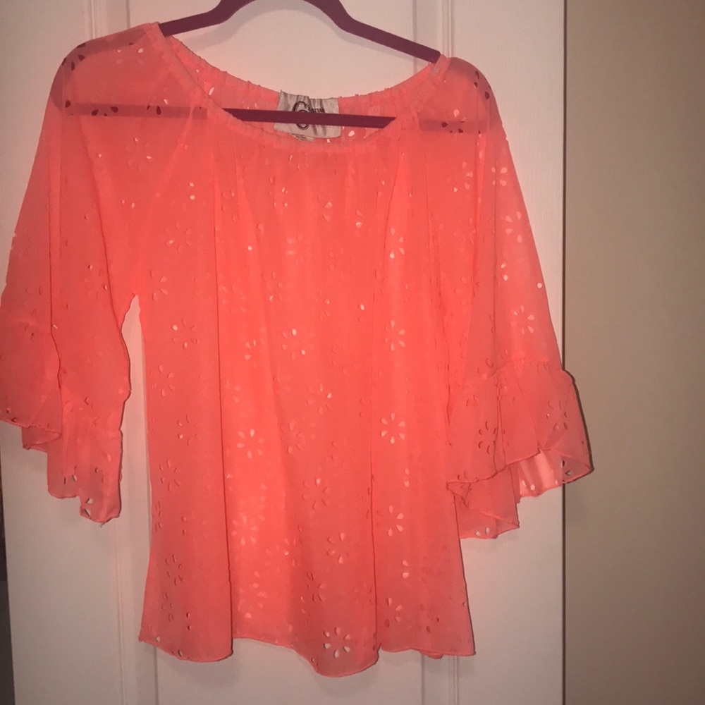 Neon pink top with cutout flowers